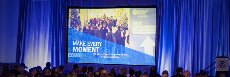 LM-DHS-Work-Grid-full-width-2000×667 Department of Homeland Security presentation created by LOMA Media being shown to US Government partners